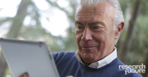 man using ipad outside